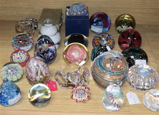 Twenty seven various coloured paperweights